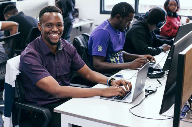 Andela-Developer-Jonathan-Ngondi-at-workstation-in-Kenya