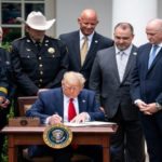 Trump signs order pushing to reduce US police violence