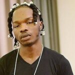 That is not me!!! – Naira Marley Denies Viral Photo Of A Look-Alike Posing With A Naked Woman